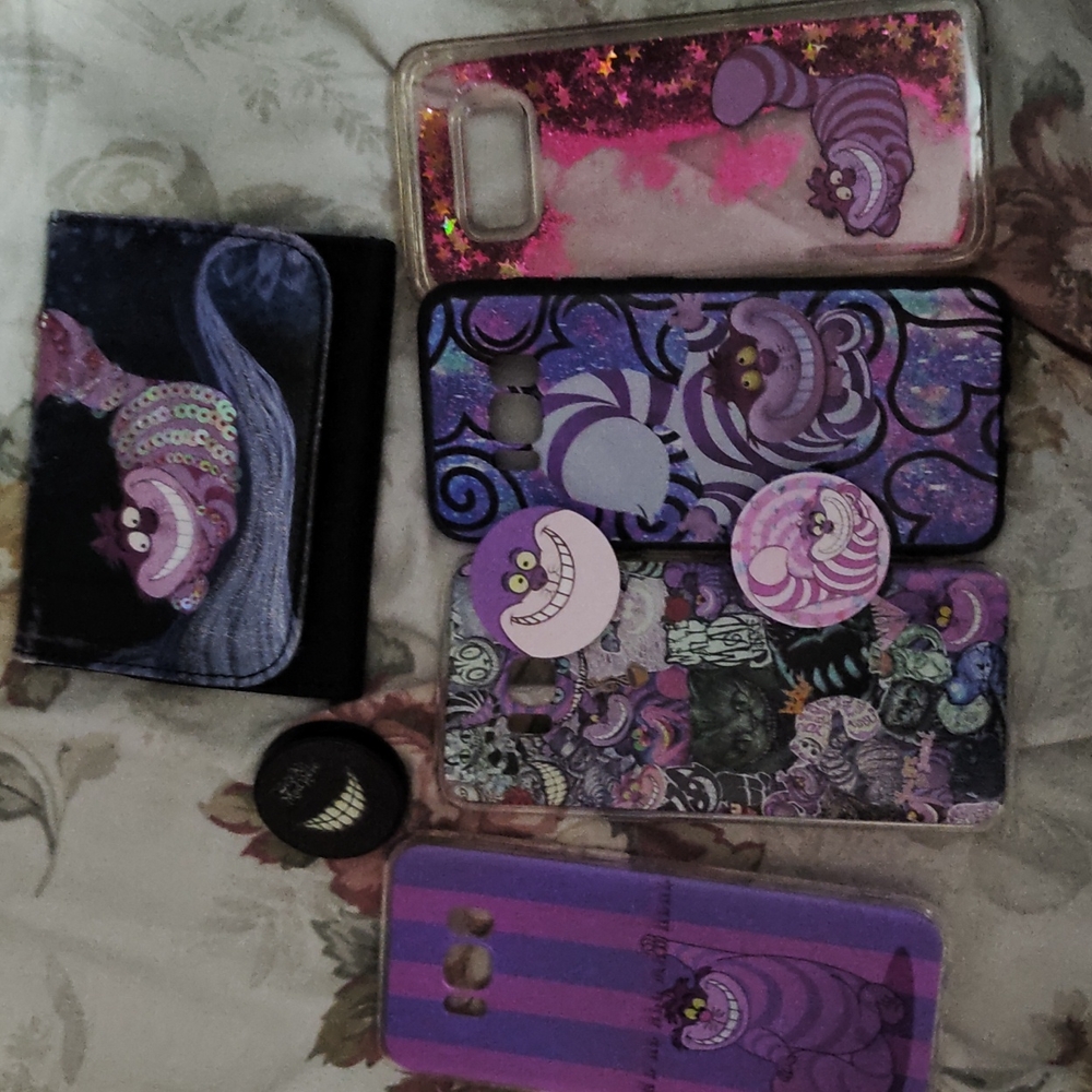 Chesire cat bundle has phone cases key chain and pocket sockets